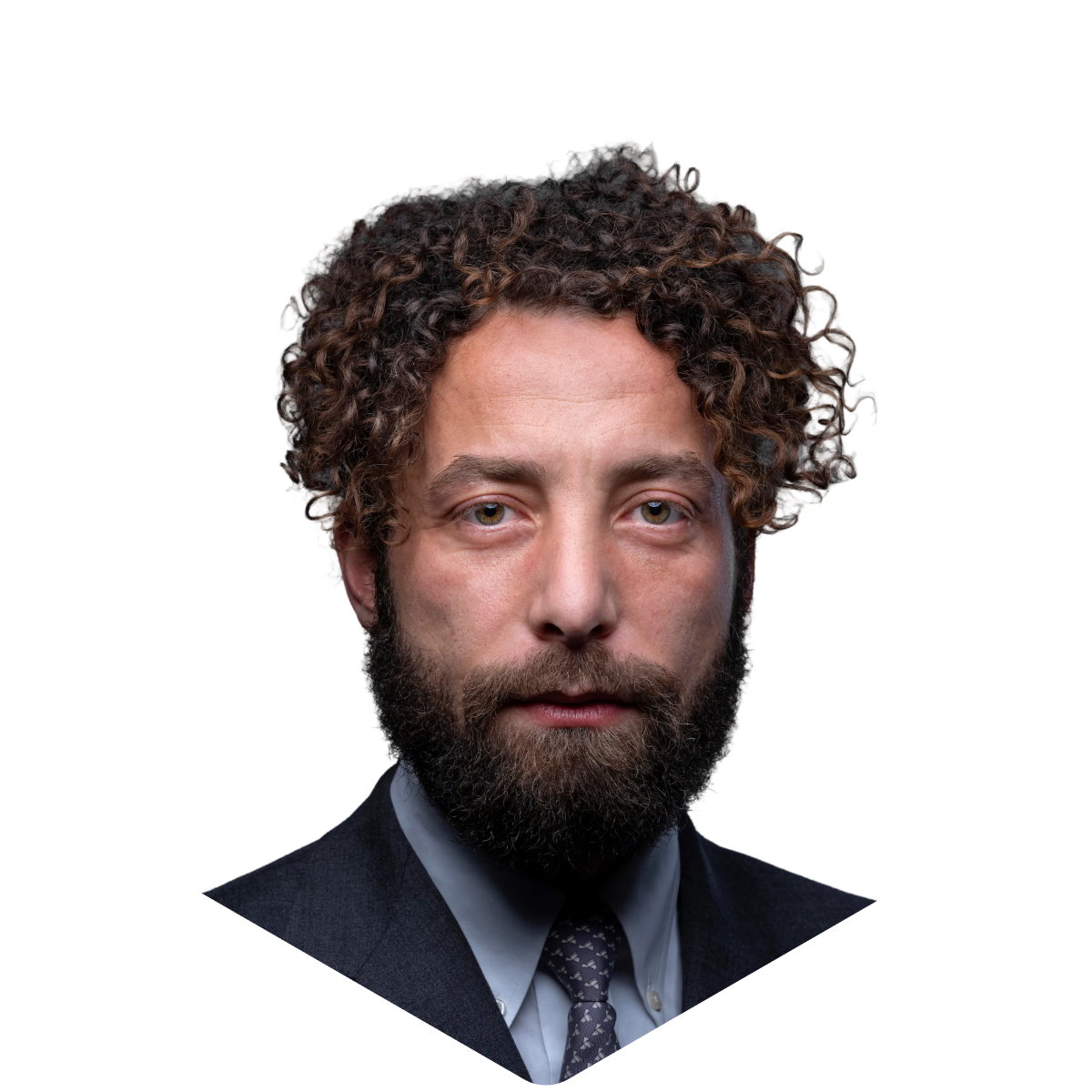Curly-haired man in a suit with a beard, serious expression, professional headshot.