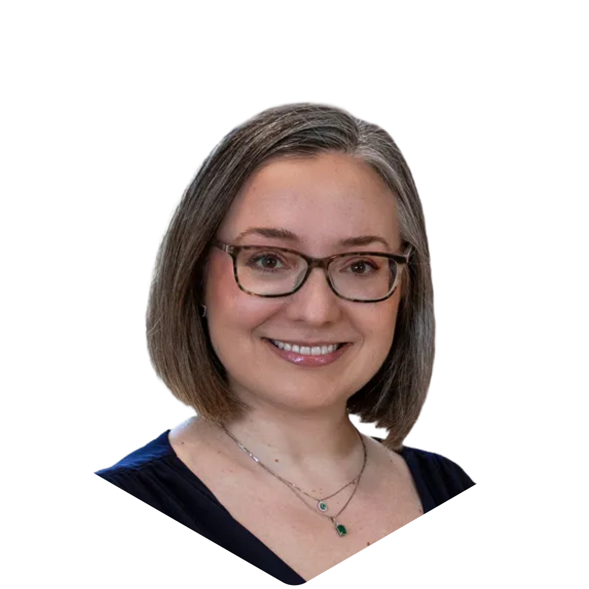 Portrait of a smiling person with glasses and shoulder-length hair, wearing a necklace and a dark top.