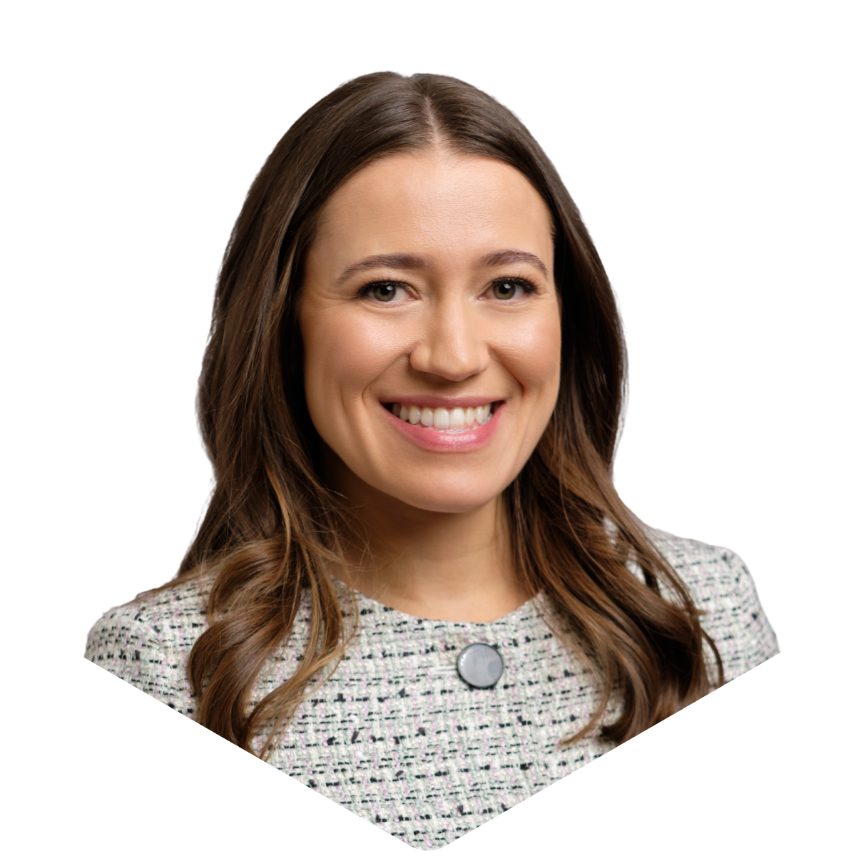 Smiling woman with long brown hair, wearing a white patterned top with a round button, on a plain background.