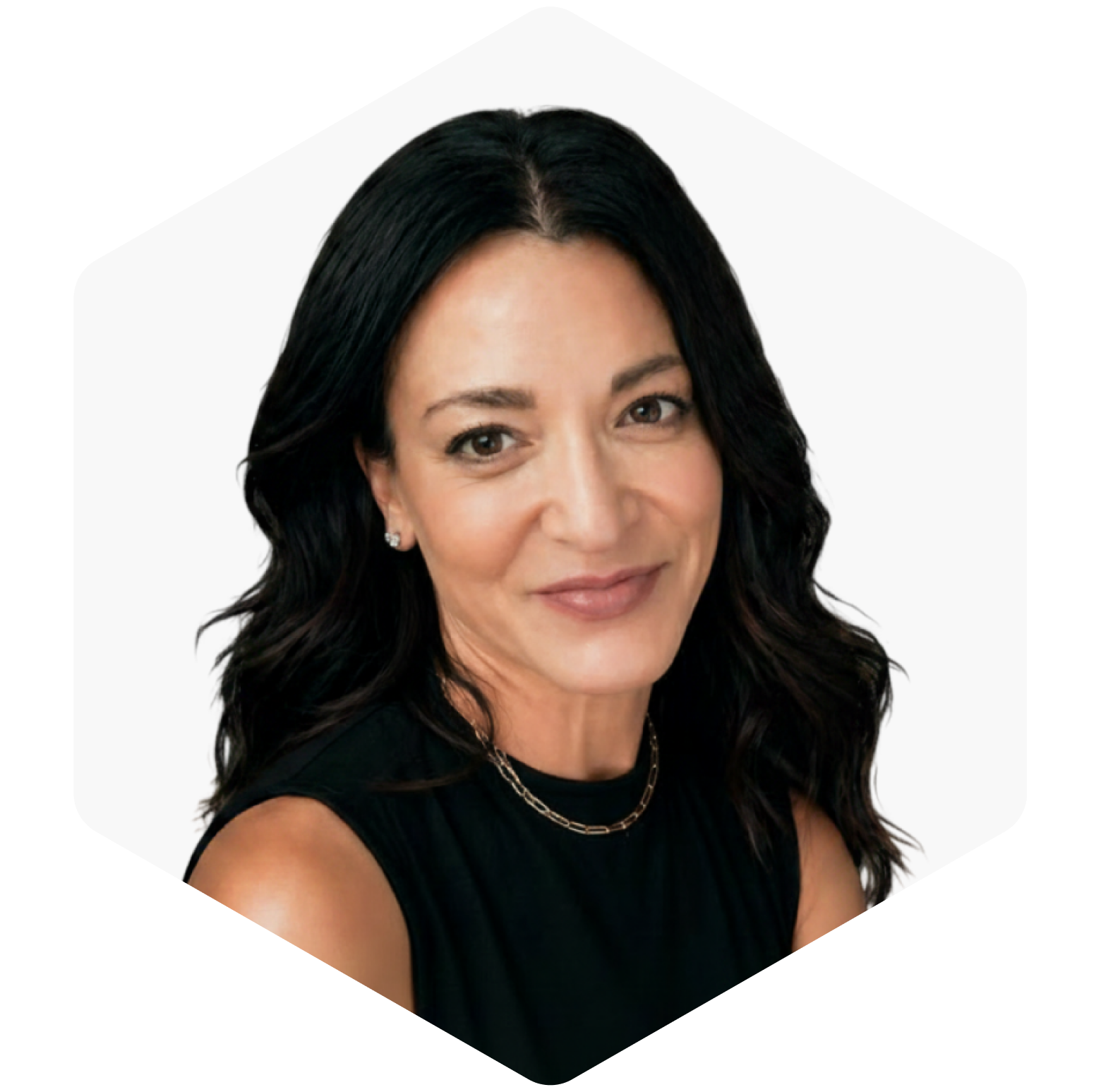 Portrait of a smiling woman with long dark hair, wearing a black top and necklace against a white background.